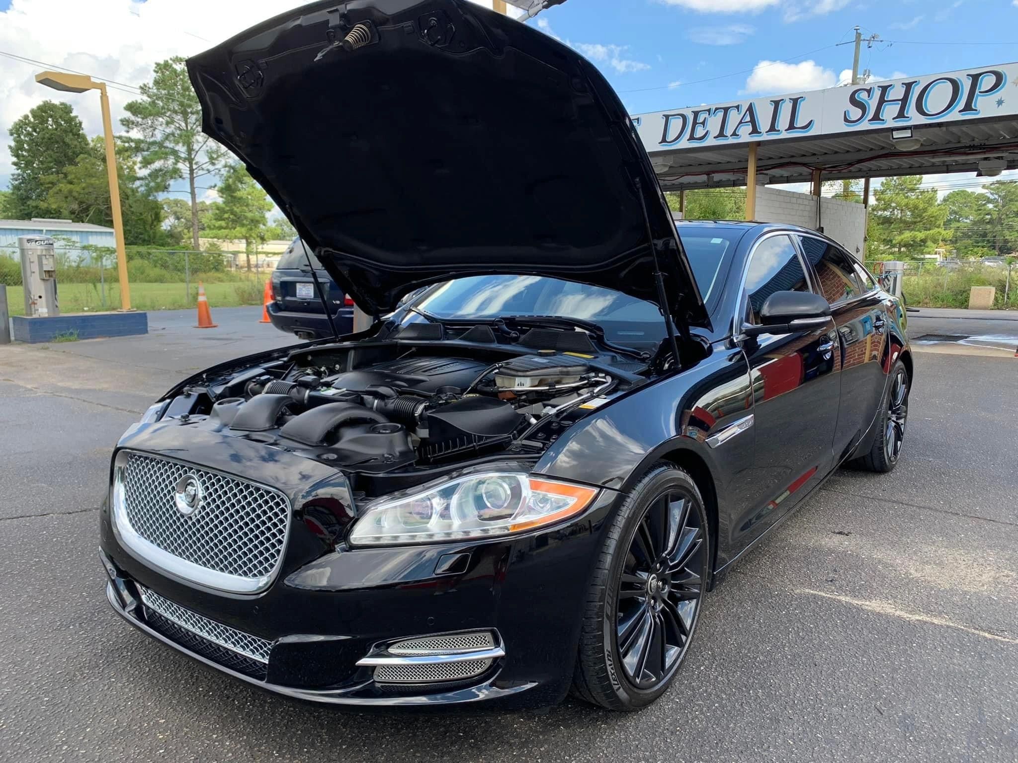 Detailed black Jaguar with clean engine bay