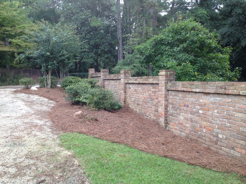 Planting beds and brick wall in Ground Pounders’ Winterlochen Drive project gallery